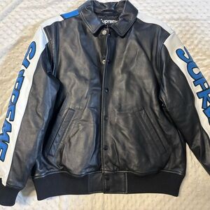 Supreme Black Leather Jacket with White Sleeves and Blue Accents